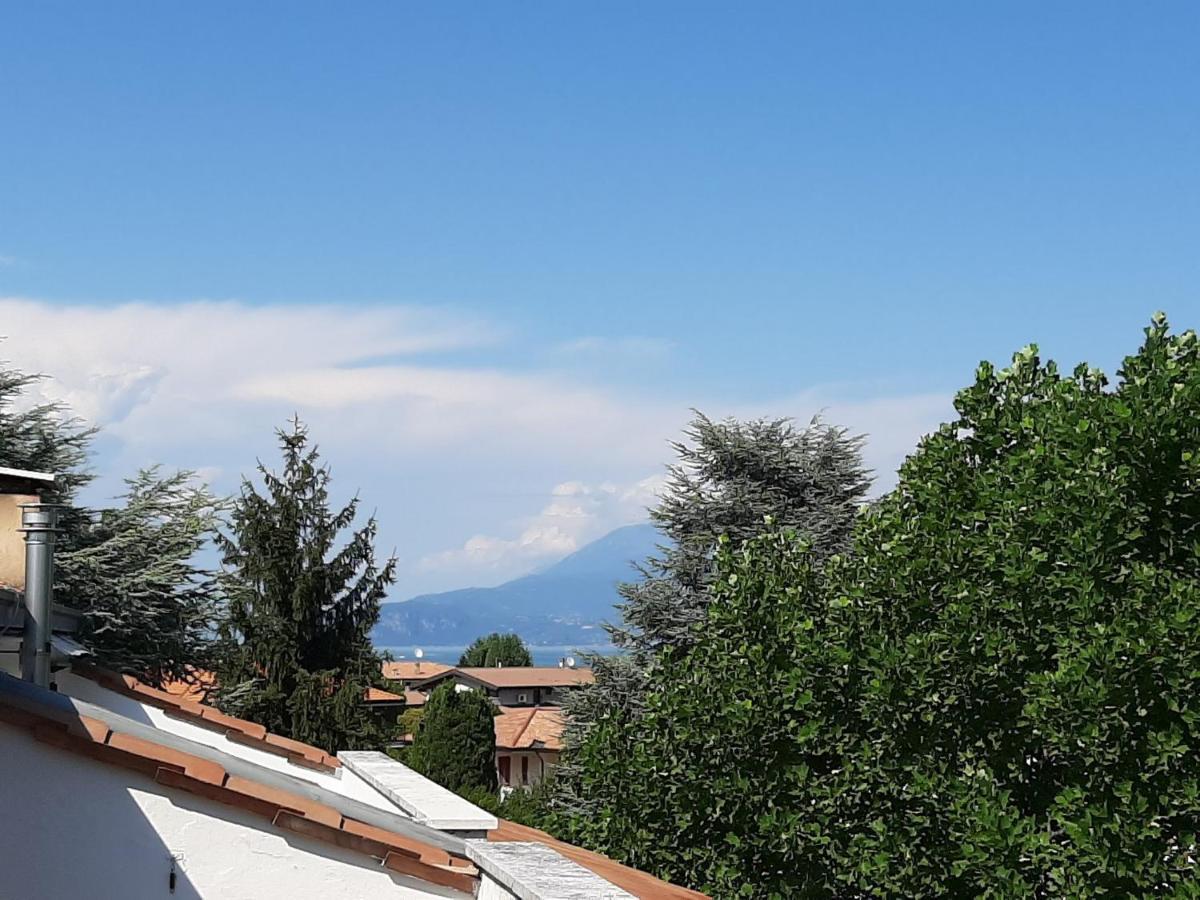 Appartamento Genziana - Con Vista Piscina E Garage Сирмионе Екстериор снимка